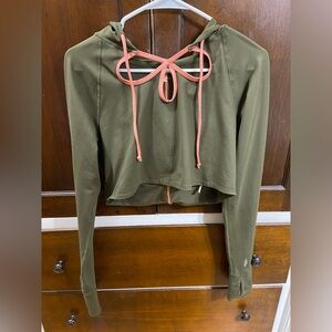 FP Movement long sleeved crop top with cut out detail, size medium, neve…